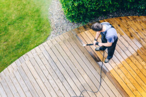 cleaning wood deck with a pressure washer in ABQ